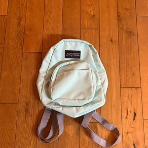 jansport teal mini backpack with grey straps

barley used practically new